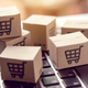 A photo of tiny cardboard boxes with shopping cats on them